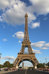Fototapeta na wymiar Great Eiffel Tower and the street with few cars