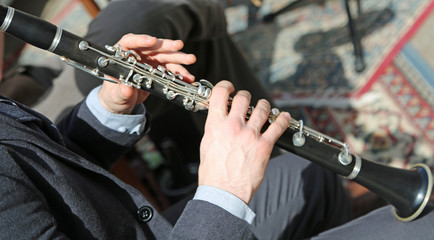 Musician plays the flute in the orchestra
