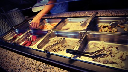 raw food and shrimp skewers in the self-service restaurant