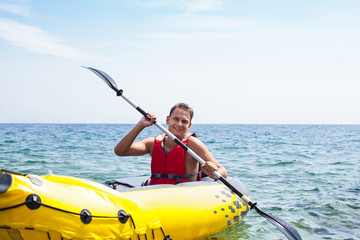 Young man kayaking