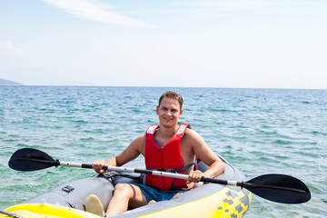 Young man kayaking