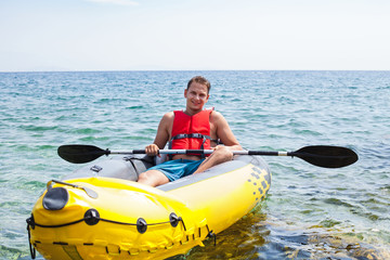Young man kayaking