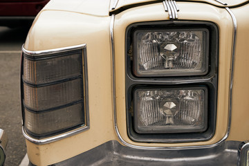 An image of a headlight of an old car.