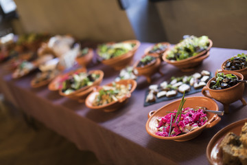 Medieval dishes on a plate on a purple tablecloth