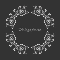 Vintage style empty round  silver frame on dark backdrop. Template for invitation, anniversary, greeting card.