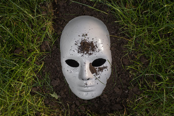 White Scary  mask on the ground,Halloween concept
