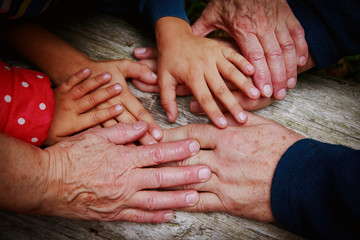 grandparents and kids hands, concept of family and parenting