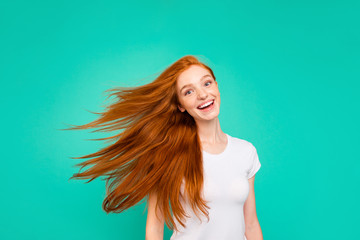 Portrait of careless, carefree lady isolated on vivid teal backg