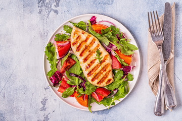 Chicken breast with fresh salad.