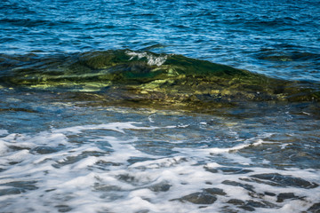 Blue sea and small wave, Crystal Clear sea over a reef in the mediterranean