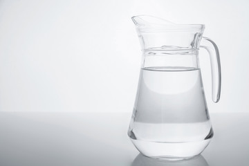 Glass transparent jar filled with clean water.
