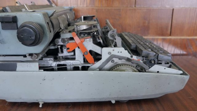  Side view of typewriter inner parts. Concept of broken typewriter, Service center.
