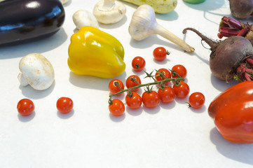 Pepper with tomato and beets, garlic, champignons on a white background. Horizontal.