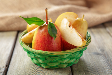 Ripe pears on rustic wooden table