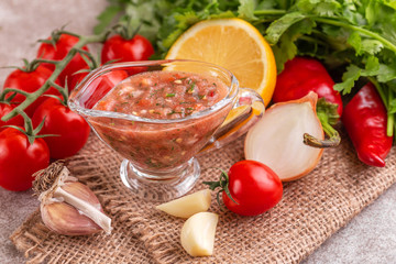Traditional mexican red spicy sauce with ingredients