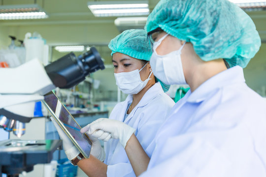 Scientist using a microscope in a laboratory, Concept science and Technology