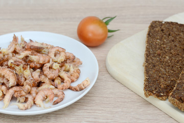 north sea crabs in the bowl  and black bread on wood