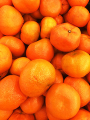Healthy fruits, orange fruits background many orange fruits - orange fruit background in a supermarket super store