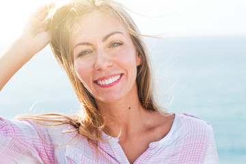 portrait happy smiling travelling blonde girl island