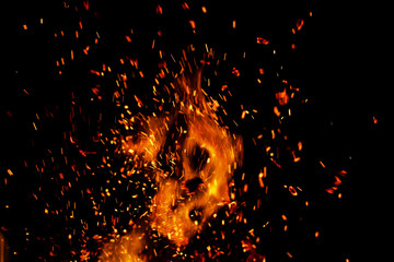 flame of fire with sparks on a black background