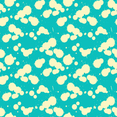 paint splatters seamless tile in ivory on blue