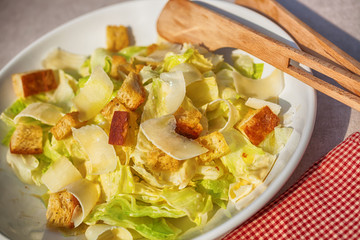 Caesar salad with crystal lettuce, croutons and parmesan shavings