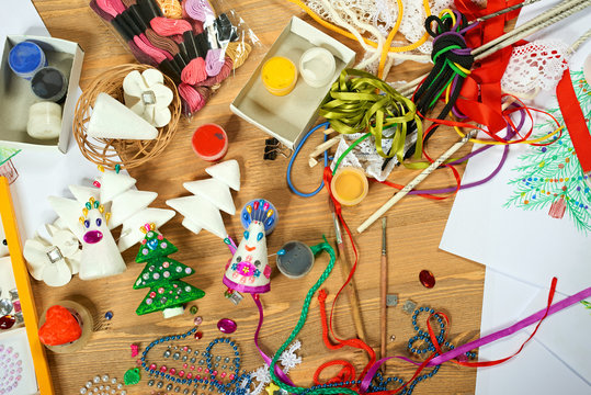 Handmade decorations for new year and other holidays. Artwork workplace with creative accessories.