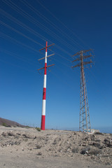 Two impressive towers of high voltage electricity transport.
