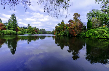 English autumn with Sheffield lake and trees in Uckfield, East Sussex, United Kingdom