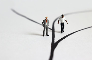 Miniature men of different races.