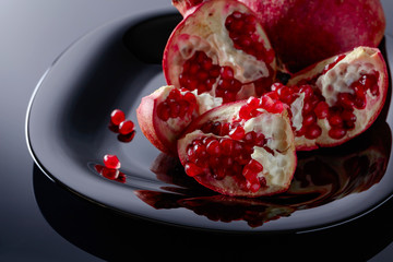 Pomegranate on black  background.