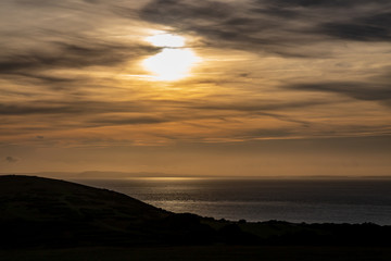 Fototapeta na wymiar Sunset over the sea, taken from Tennyson Down on the Isle of Wight