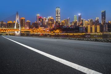 Fototapeta na wymiar Road pavement and Chongqing urban architecture skyline