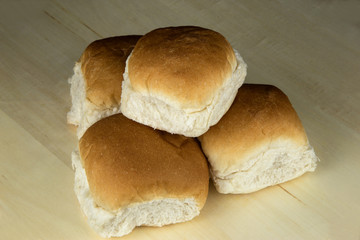Fresh Bread Rolls on a Wooden Surface
