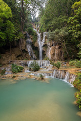 Fototapeta na wymiar Beautiful view of the main fall at the Tat Kuang Si Waterfalls near Luang Prabang in Laos.