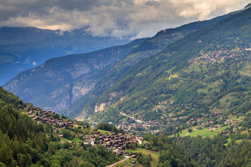 Beautiful view of the Val d’Anniviers valley in Switzerland with the villages saint-luc, saint-jean and vissoie in summer
