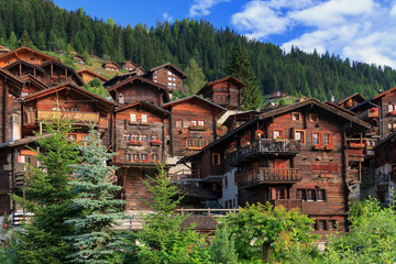 Fototapeta na wymiar Beautiful cityscape of the alpine village Grimentz, Switzerland, with traditional wooden houses in summer 