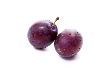 Group of ripe plums isolated on a white background..