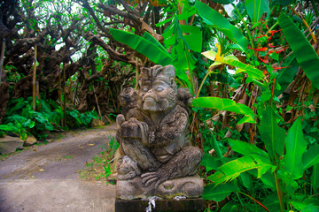 Indonesian historical statue nearby the beach of the Bali island, Indonesia. Bali is an Indonesian island and known as a tourist destination. In Bali, rice harvest seasons come three times in a year.