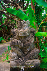 Indonesian historical statue nearby the beach of the Bali island, Indonesia. Bali is an Indonesian island and known as a tourist destination. In Bali, rice harvest seasons come three times in a year.