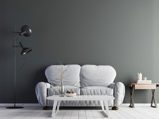 Modern interior with grey empty wall & sofa with low table on floor.