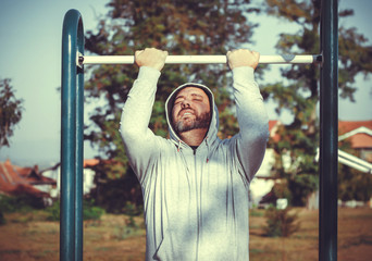 Man doing a pull-up exercise