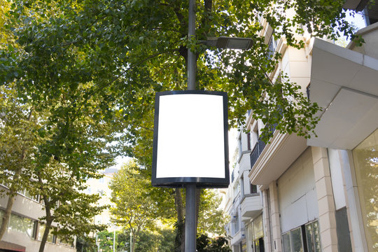 Mock up. Advertising template on the pole in street