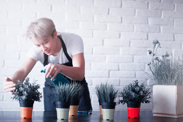 Young Asian boy takes care of plants