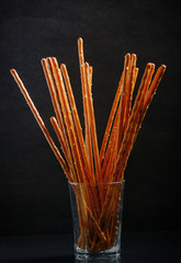 Fototapeta premium Pretzel sticks in small glass