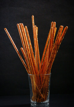 Pretzel sticks in small glass