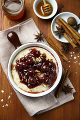 Oatmeal porridge with cherry sauce and spices