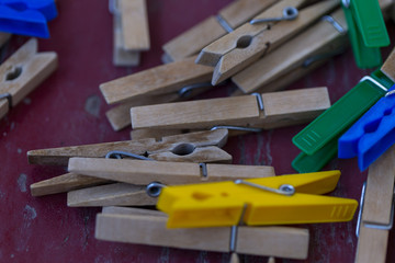retro wooden clothespins on wood surface