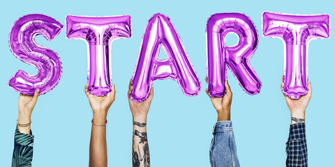 Hands holding start word balloon