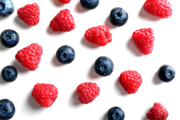 Delicious ripe berries on white background, top view